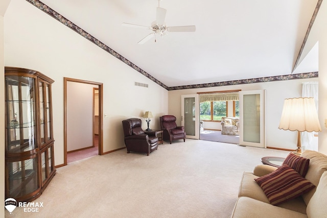 living area featuring light colored carpet, baseboards, high vaulted ceiling, and ceiling fan