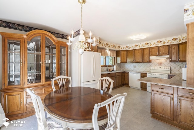 dining room with a chandelier and light floors