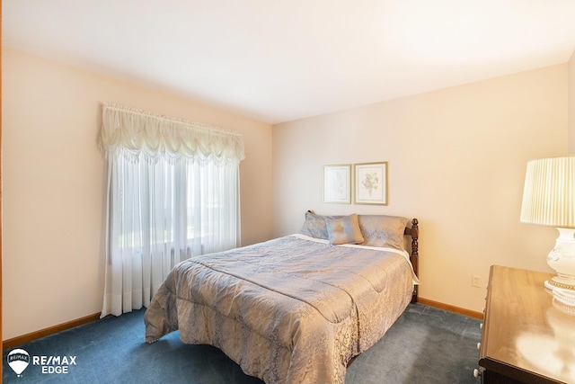 carpeted bedroom with baseboards