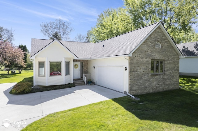 view of front of home featuring a garage, driveway, a front yard, brick siding, and roof with shingles