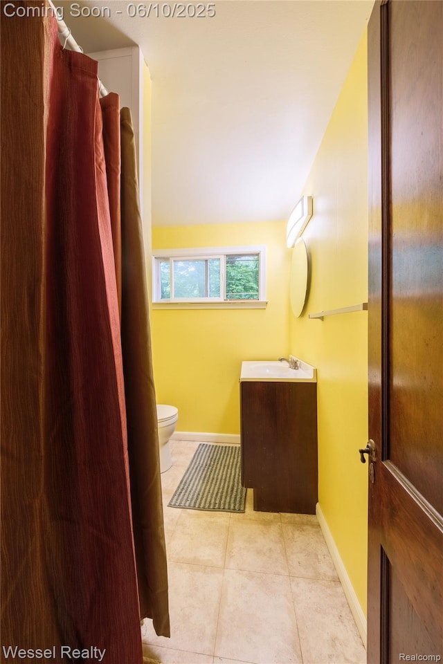 337 Chandler St, Romeo, MI 48065 - bathroom with vanity, baseboards, tile patterned flooring, and toilet
