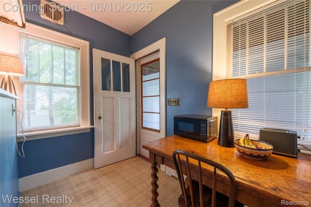337 Chandler St, Romeo, MI 48065 - dining area with tile patterned floors, baseboards, and a desk