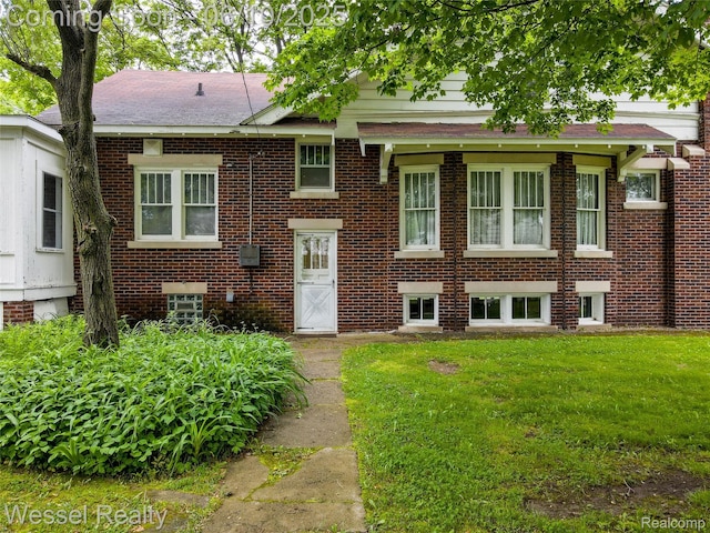 337 Chandler St, Romeo, MI 48065 - view of front facade with a front yard and brick siding
