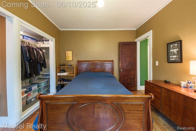 337 Chandler St, Romeo, MI 48065 - bedroom featuring wood finished floors, crown molding, and a closet