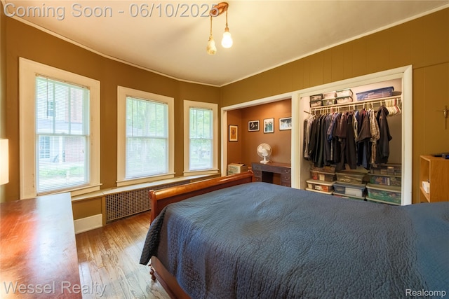337 Chandler St, Romeo, MI 48065 - bedroom featuring wood finished floors, crown molding, and a closet