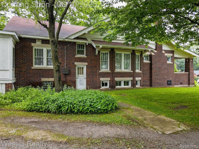 337 Chandler St, Romeo, MI 48065 - view of front facade with a front lawn, brick siding, and a shingled roof