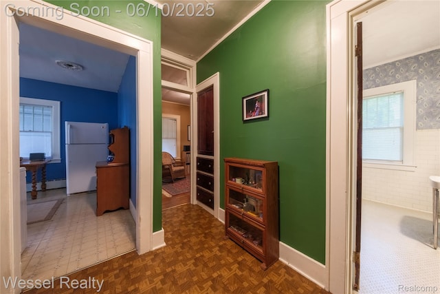 337 Chandler St, Romeo, MI 48065 - hallway with baseboards, ornamental molding, and a baseboard heating unit