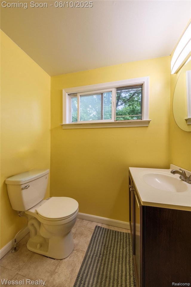 337 Chandler St, Romeo, MI 48065 - bathroom featuring toilet, vanity, baseboards, and tile patterned flooring