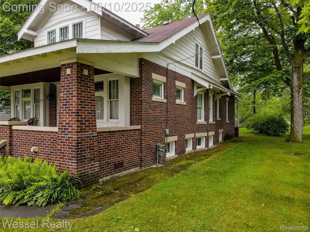 337 Chandler St, Romeo, MI 48065 - view of home's exterior featuring brick siding and a yard