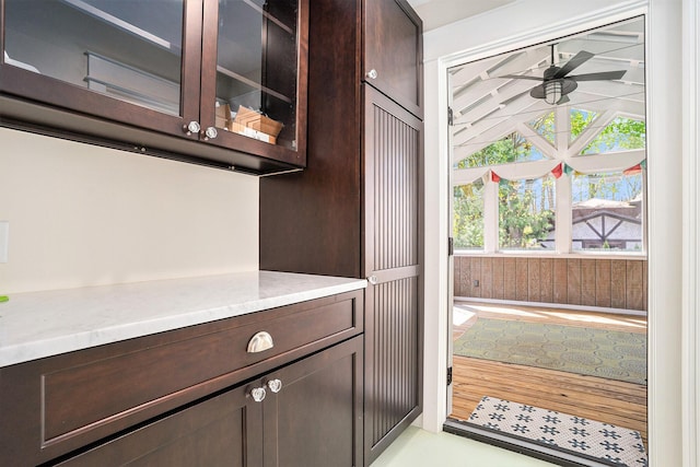 doorway to outside featuring a ceiling fan