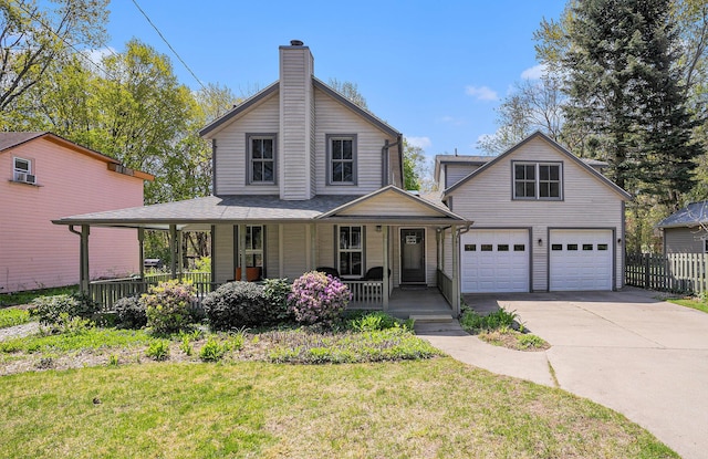 view of front of home featuring covered porch, a garage, concrete driveway, and a chimney