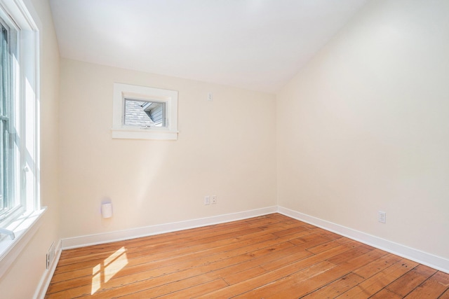 unfurnished room featuring light wood-style flooring and baseboards