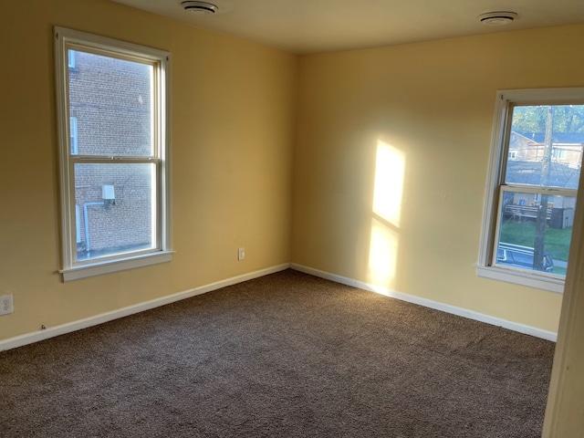 50 Henderson St, Pontiac, MI 48341 - carpeted empty room with baseboards