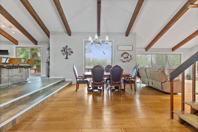 343 Shotwell, White Lake, MI 48386 - dining room featuring a chandelier, beam ceiling, healthy amount of natural light, and stairs