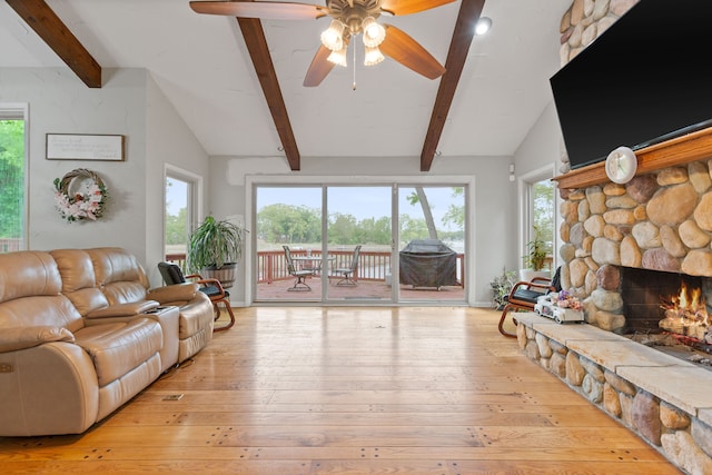 343 Shotwell, White Lake, MI 48386 - living room with a stone fireplace, hardwood / wood-style floors, ceiling fan, and healthy amount of natural light