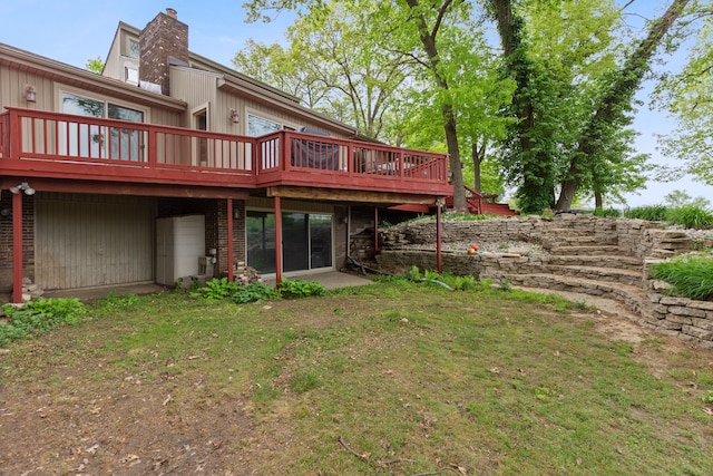 343 Shotwell, White Lake, MI 48386 - rear view of house with a deck, a chimney, and a yard