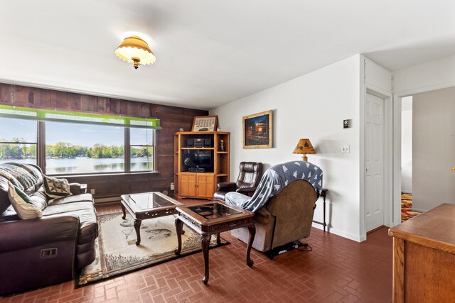 15065 Becker Dr, Mecosta, MI 49332 - living area featuring brick patterned flooring and wooden walls