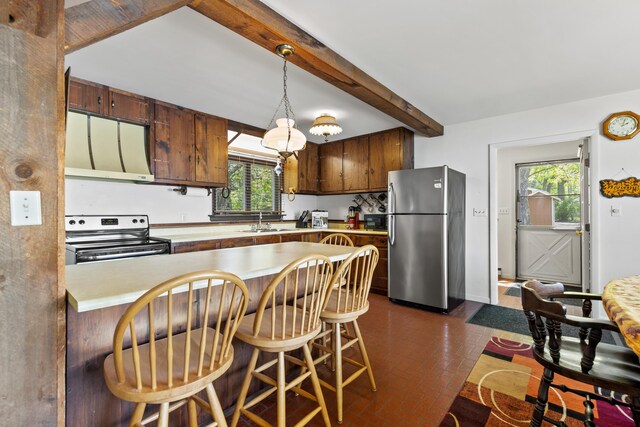 15065 Becker Dr, Mecosta, MI 49332 - kitchen featuring stainless steel appliances, brick floors, a peninsula, light countertops, and beamed ceiling