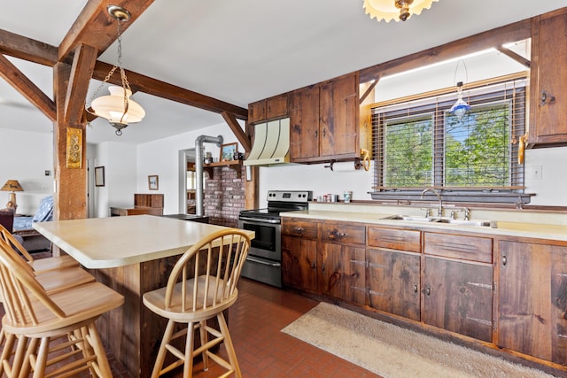 15065 Becker Dr, Mecosta, MI 49332 - kitchen with stainless steel electric range oven, a sink, brick floors, and light countertops