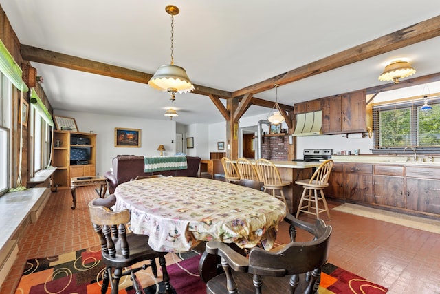 15065 Becker Dr, Mecosta, MI 49332 - dining area featuring brick patterned flooring and beamed ceiling