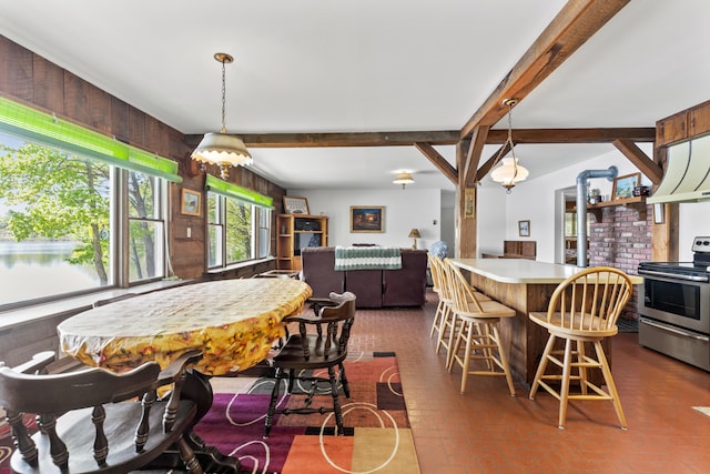 15065 Becker Dr, Mecosta, MI 49332 - dining area with brick patterned floors, wood walls, beamed ceiling, and a chandelier