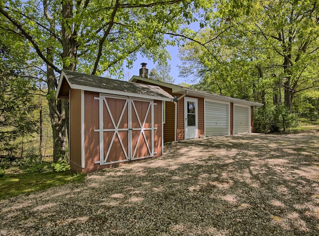 15065 Becker Dr, Mecosta, MI 49332 - view of shed featuring an attached garage