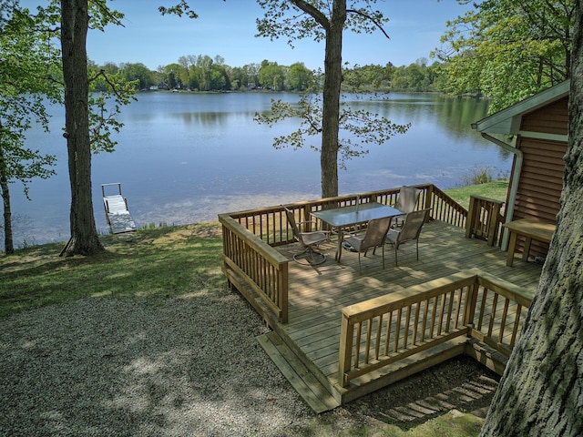 15065 Becker Dr, Mecosta, MI 49332 - deck featuring a water view and outdoor dining area