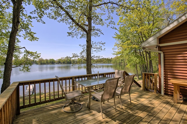 15065 Becker Dr, Mecosta, MI 49332 - wooden terrace featuring outdoor dining space and a water view