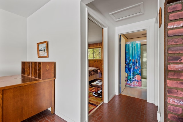 15065 Becker Dr, Mecosta, MI 49332 - hallway featuring brick flooring and attic access