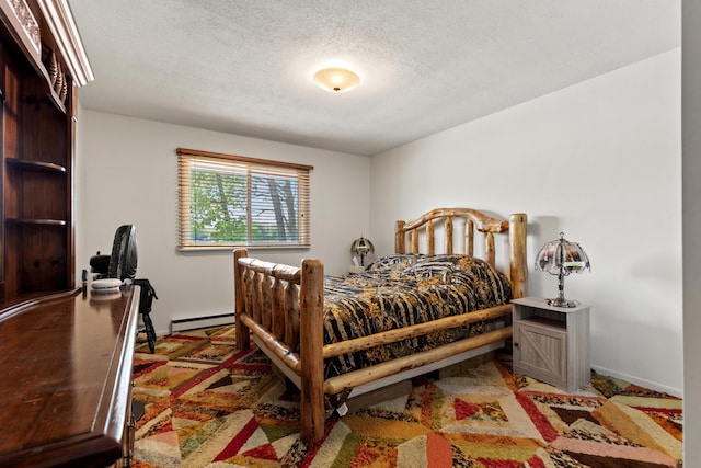 15065 Becker Dr, Mecosta, MI 49332 - bedroom with a baseboard radiator, baseboards, and a textured ceiling
