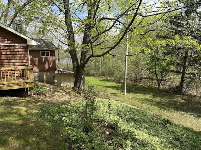 15065 Becker Dr, Mecosta, MI 49332 - view of grassy yard with a wooden deck