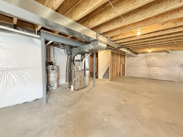 unfinished below grade area featuring water heater, heating unit, and stairs