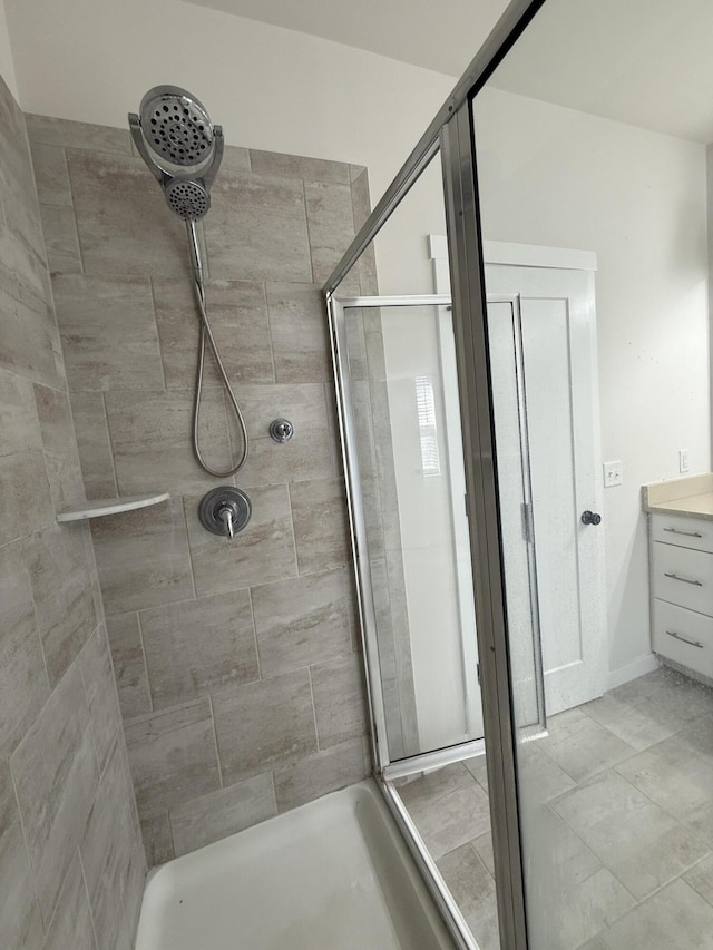 full bath featuring a shower stall