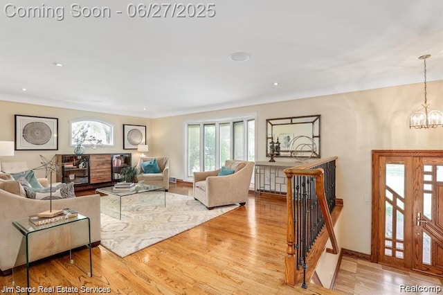 21838 Van K Dr, Grosse Pointe Woods, MI 48236 - living room featuring healthy amount of natural light, wood finished floors, a chandelier, and recessed lighting