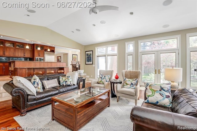 21838 Van K Dr, Grosse Pointe Woods, MI 48236 - living area featuring vaulted ceiling, french doors, and light wood-style flooring