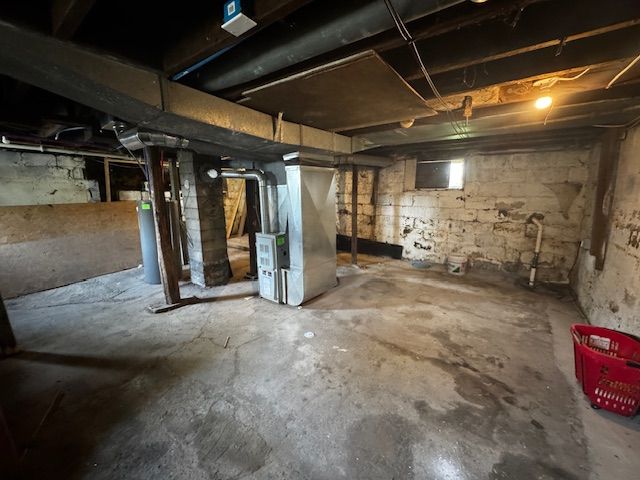 1143 Ballard St, Lansing, MI 48906 - basement featuring heating unit