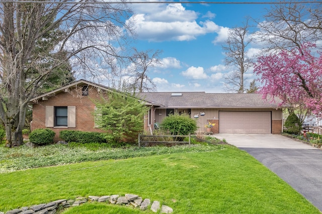 1366 E Coon Lake Rd, Howell, MI 48843 - ranch-style home featuring brick siding, asphalt driveway, a garage, a front lawn, and a shingled roof
