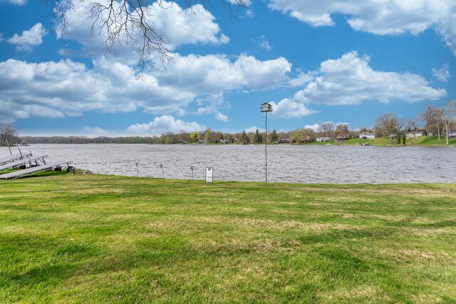 1366 E Coon Lake Rd, Howell, MI 48843 - view of green lawn with a water view and a boat dock
