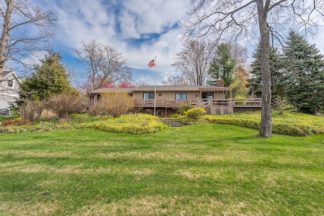 1366 E Coon Lake Rd, Howell, MI 48843 - back of house with a chimney, a wooden deck, and a yard