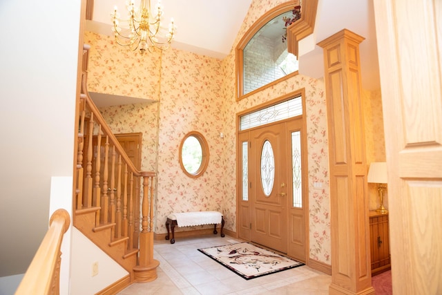 2865 Vw Ave E, Vicksburg, MI 49097 - entryway featuring wallpapered walls, a chandelier, stairs, light tile patterned flooring, and baseboards