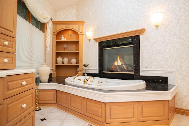 2865 Vw Ave E, Vicksburg, MI 49097 - bathroom featuring wallpapered walls, tile patterned flooring, a bath, and a premium fireplace