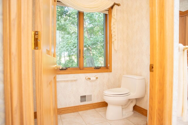 2865 Vw Ave E, Vicksburg, MI 49097 - bathroom with toilet, tile patterned flooring, baseboards, and wallpapered walls