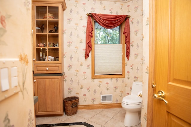 2865 Vw Ave E, Vicksburg, MI 49097 - bathroom with tile patterned floors, toilet, wallpapered walls, and baseboards