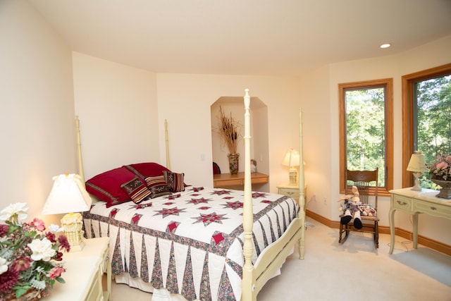 2865 Vw Ave E, Vicksburg, MI 49097 - bedroom featuring arched walkways, light carpet, and baseboards
