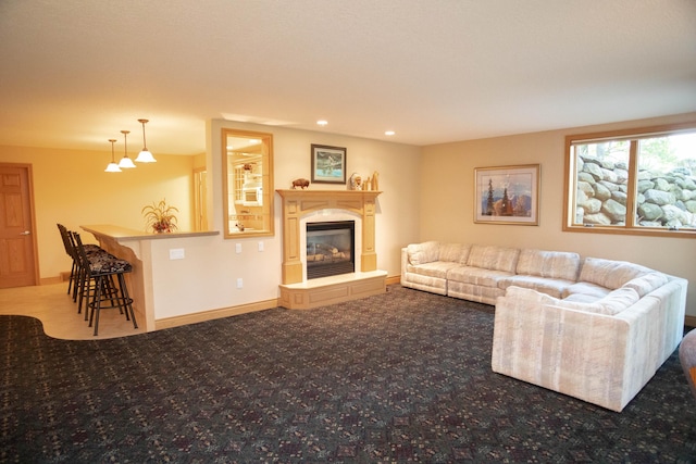 2865 Vw Ave E, Vicksburg, MI 49097 - carpeted living room with recessed lighting, a glass covered fireplace, and baseboards