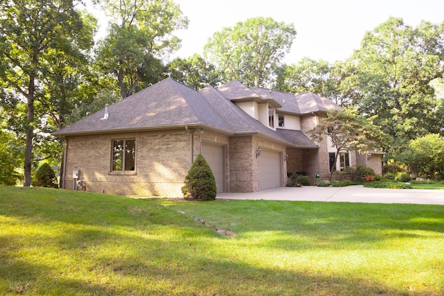 2865 Vw Ave E, Vicksburg, MI 49097 - view of front of home featuring a garage, brick siding, concrete driveway, and a front lawn