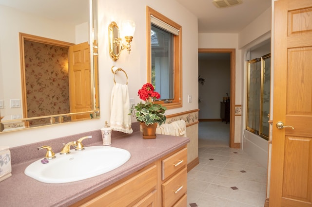 2865 Vw Ave E, Vicksburg, MI 49097 - full bathroom featuring tile patterned floors, vanity, and enclosed tub / shower combo