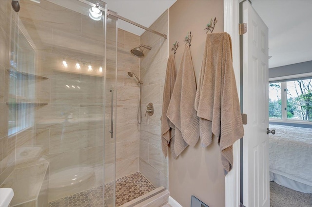 full bath with a shower stall and ensuite bathroom