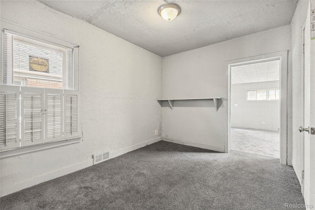 5856 Barrett St, Detroit, MI 48213 - carpeted spare room with a textured ceiling