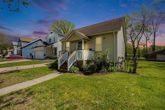 view of front of property featuring an attached garage, a shingled roof, and concrete driveway